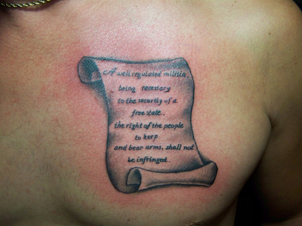 Татуировка грамота с надписью.